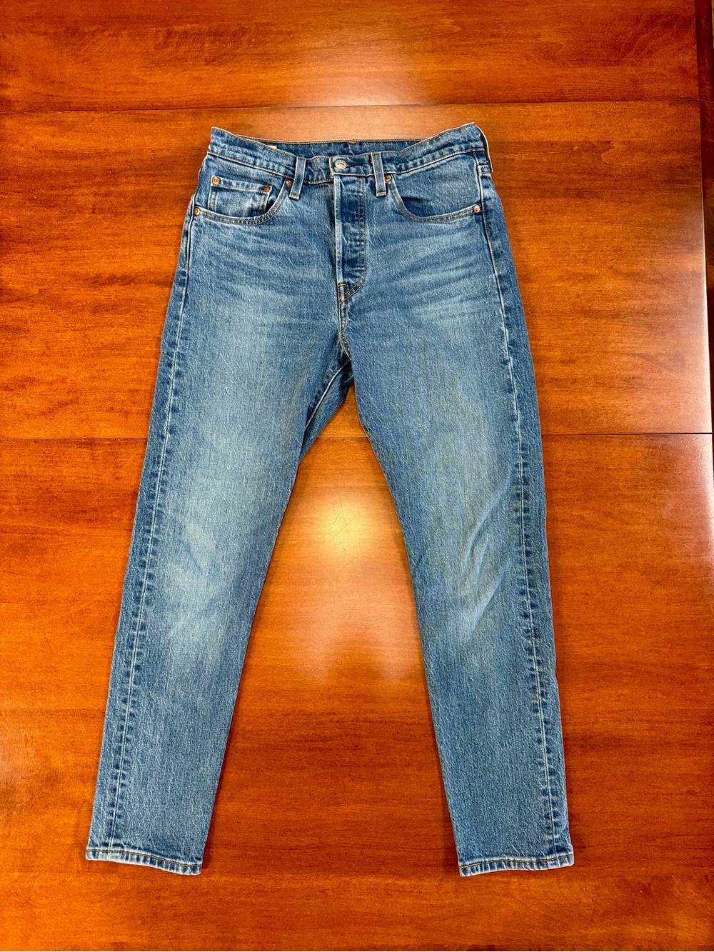 Levi's women's straight leg jeans in medium blue wash with button fly